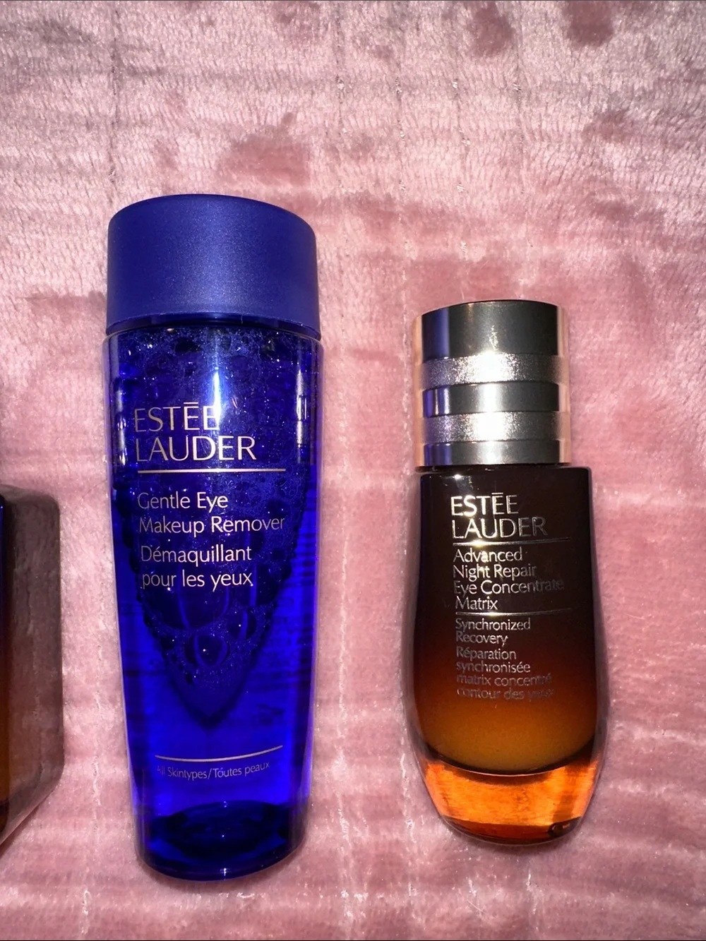 Estee Lauder Skincare Assortment with Blue, Pink, Gold and Brown Accents